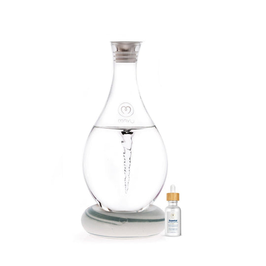 The Mayu Water Basic Starter Kit features a Swirl Structured Water Carafe with vortex technology, sitting on a round base next to a Trace Mineral Drops bottle with a white label and wooden cap.