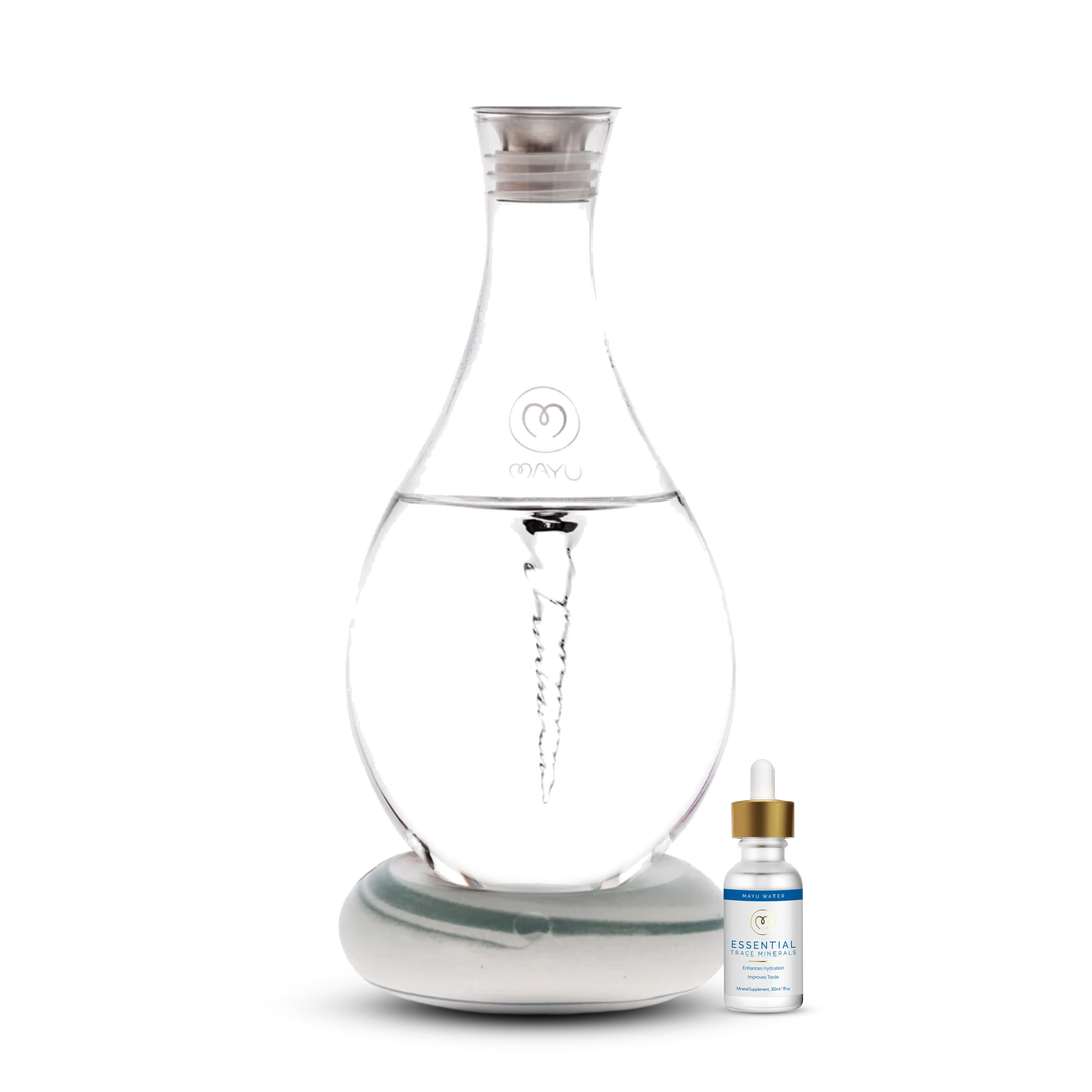 The Mayu Water Basic Starter Kit features a clear Swirl Structured Water Carafe with vortex technology on a round base, accompanied by a small Trace Mineral Drops bottle, both displayed against a white background.