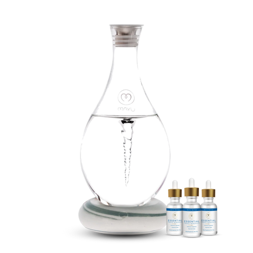 The Best Selling Starter Kit by Mayu Water features a clear Structured Water Carafe with a vortex on a base, alongside three Essential Minerals dropper bottles—an innovative hydration solution for enhanced wellness.