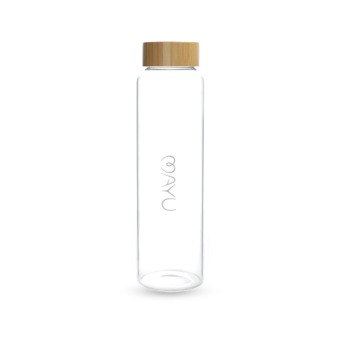 The Mayu Water Pure Glass Bottle is a BPA-free, cylindrical water bottle with a bamboo screw-on lid and "AYA" printed vertically in white on the front. Its eco-friendly design stands out against a white background.