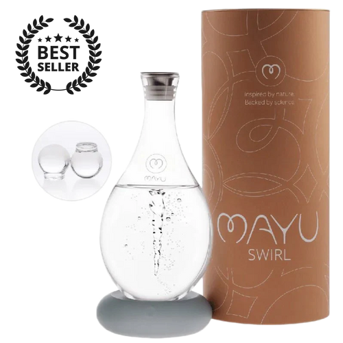 The MAYU Swirl Carafe by Mayu Water stands on a round base beside its brown cylindrical box. A "Best Seller" badge and two glass spheres showcase this hydration solution designed to enhance your drinking water quality.