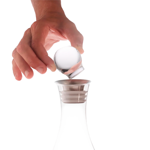 A hand lifts the Mayu Water Swirl Glass Topper from a clear decanter, echoing the elegance of the Swirl Structured Water Carafe, all set against a plain white background.