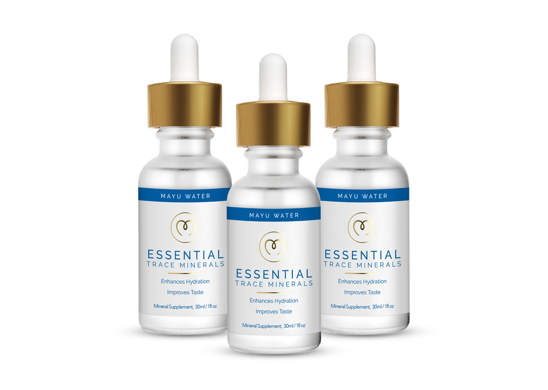 Three bottles of Mayu Water Trace Mineral Drops with gold dropper caps are side by side. The white labels highlight benefits such as enhanced hydration and better taste.