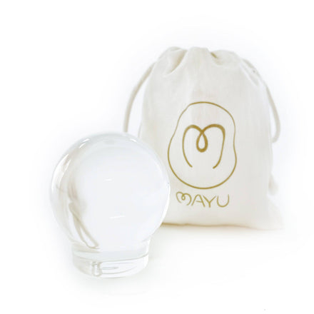 A clear Glass Topper by Mayu Water, Limited Edition, is displayed in front of a white drawstring pouch featuring a gold MAYU logo, all set against a plain white background.
